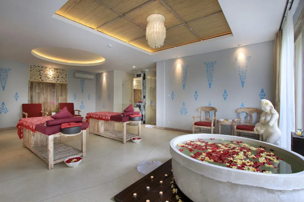 The Udaya Resorts & Spa Balinese spa experience: A beautifully arranged flower petal bath in a luxurious bathroom.